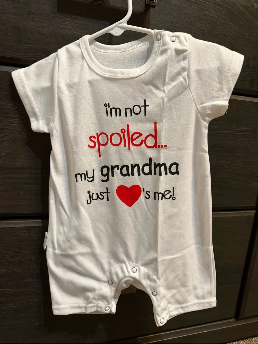 White Baby Romper with Red Heart & 'I'm Not Spoiled' Graphic